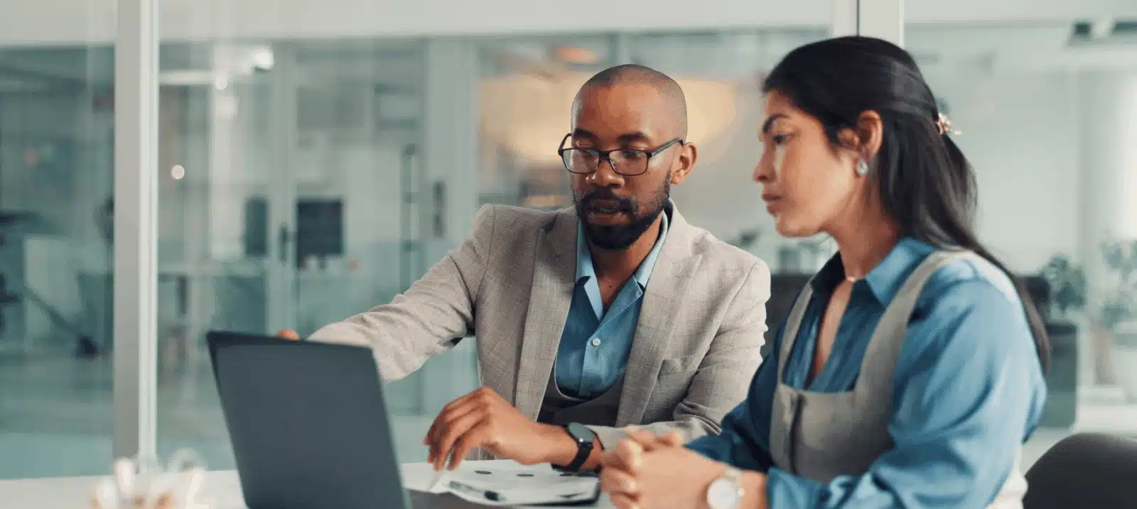 two people with laptop