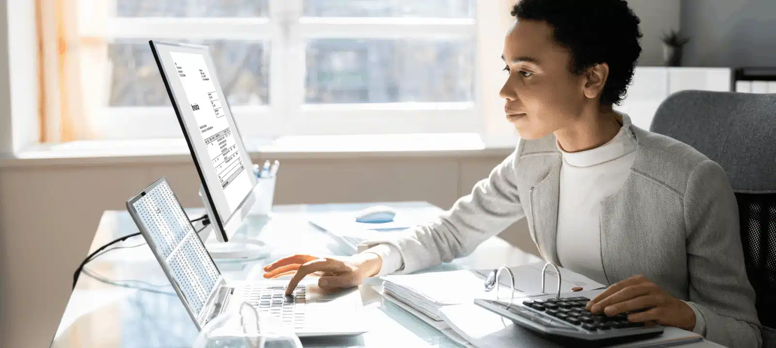 lady with calculator and laptop